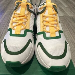 White and Green Athletic Sneakers with Yellow Accents